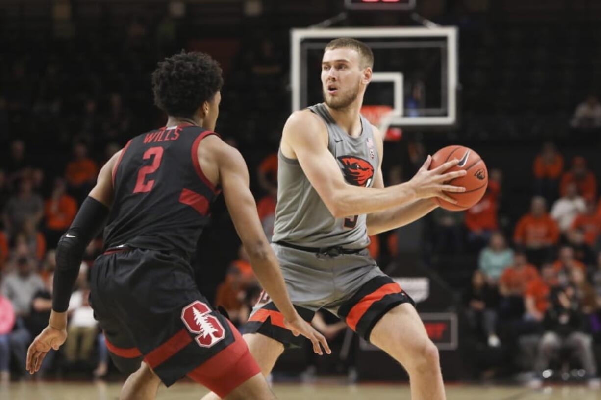 Oregon State&#039;s Tres Tinkle (3) passes around Stanford&#039;s Bryce Wills (2) during the first half of an NCAA college basketball game in Corvallis, Ore., Thursday, March 5, 2020.