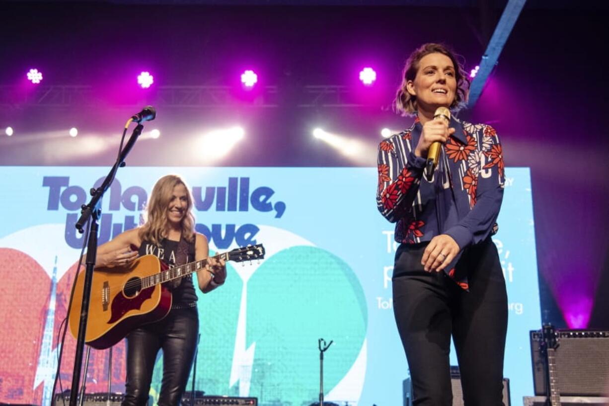 Sheryl Crow, left, and Brandi Carlile perform at the To Nashville, With Love Benefit Concert at Marathon Music Works on Monday in Nashville, Tenn.