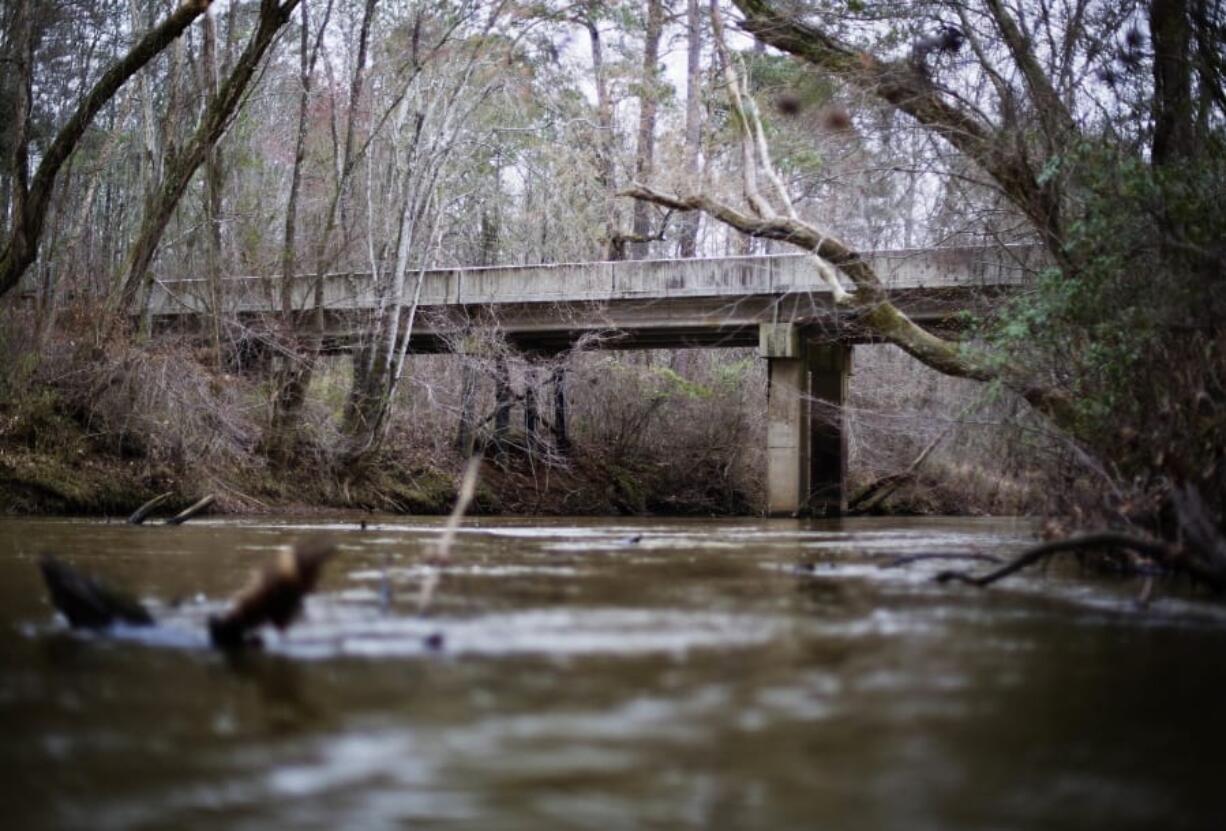 FILE- This Feb. 22, 2018, file photo shows, a bridge that spans the Apalachee River at Moore&#039;s Ford Road where in 1946 two young black couples were stopped by a white mob who dragged them to the riverbank and shot them multiple times in Monroe, Ga. A federal appeals court said Friday, March 27, 2020, that the grand jury records from the 1946 lynching of two black couples in Georgia cannot be released despite their great historical significance.