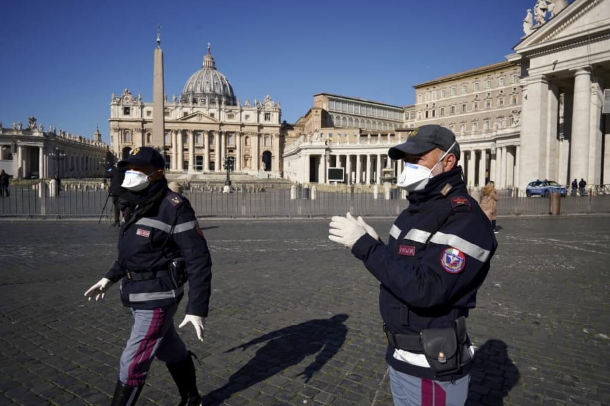 Police officers wearing masks patrol an empty St. Peter&#039;s Square at the Vatican, Wednesday, March 11, 2020. Pope Francis held his weekly general audience in the privacy of his library as the Vatican implemented Italy&#039;s drastic coronavirus lockdown measures, barring the general public from St. Peter&#039;s Square and taking precautions to limit the spread of infections in the tiny city state.For most people, the new coronavirus causes only mild or moderate symptoms, such as fever and cough. For some, especially older adults and people with existing health problems, it can cause more severe illness, including pneumonia.