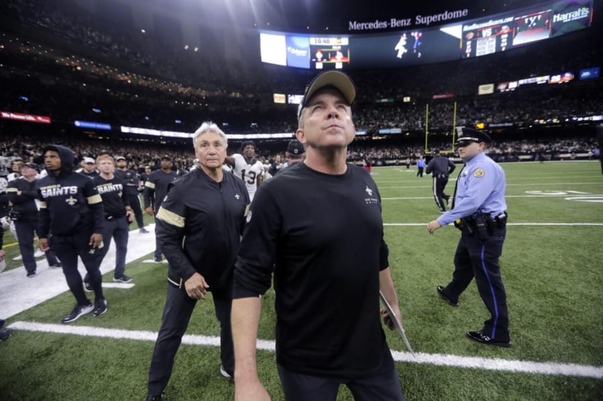 New Orleans Saints head coach Sean Payton looks up as he walks off the field after overtime of an NFL wild-card playoff football game against the Minnesota Vikings, Sunday, Jan. 5, 2020, in New Orleans. The Vikings won 26-20.