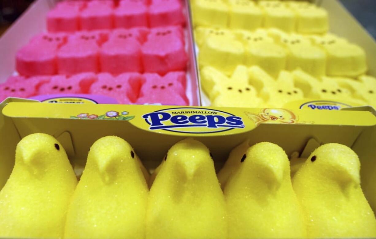 FILE - In this April 2, 2003 file photo, boxes of Marshmallow Peeps are lined up at the Just Born factory in Bethlehem, Pa.  The Bethlehem, Pa.,-based Just Born confections company said its production facilities there and in Philadelphia closed Wednesday, March 25, 2020, through April 7.