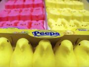 FILE - In this April 2, 2003 file photo, boxes of Marshmallow Peeps are lined up at the Just Born factory in Bethlehem, Pa.  The Bethlehem, Pa.,-based Just Born confections company said its production facilities there and in Philadelphia closed Wednesday, March 25, 2020, through April 7.