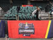 Workers dismantle seating after the men&#039;s and women&#039;s NCAA college basketball games at the Metro Atlantic Athletic Conference tournament were canceled, Thursday March 12, 2020, due to coronavirus concerns.