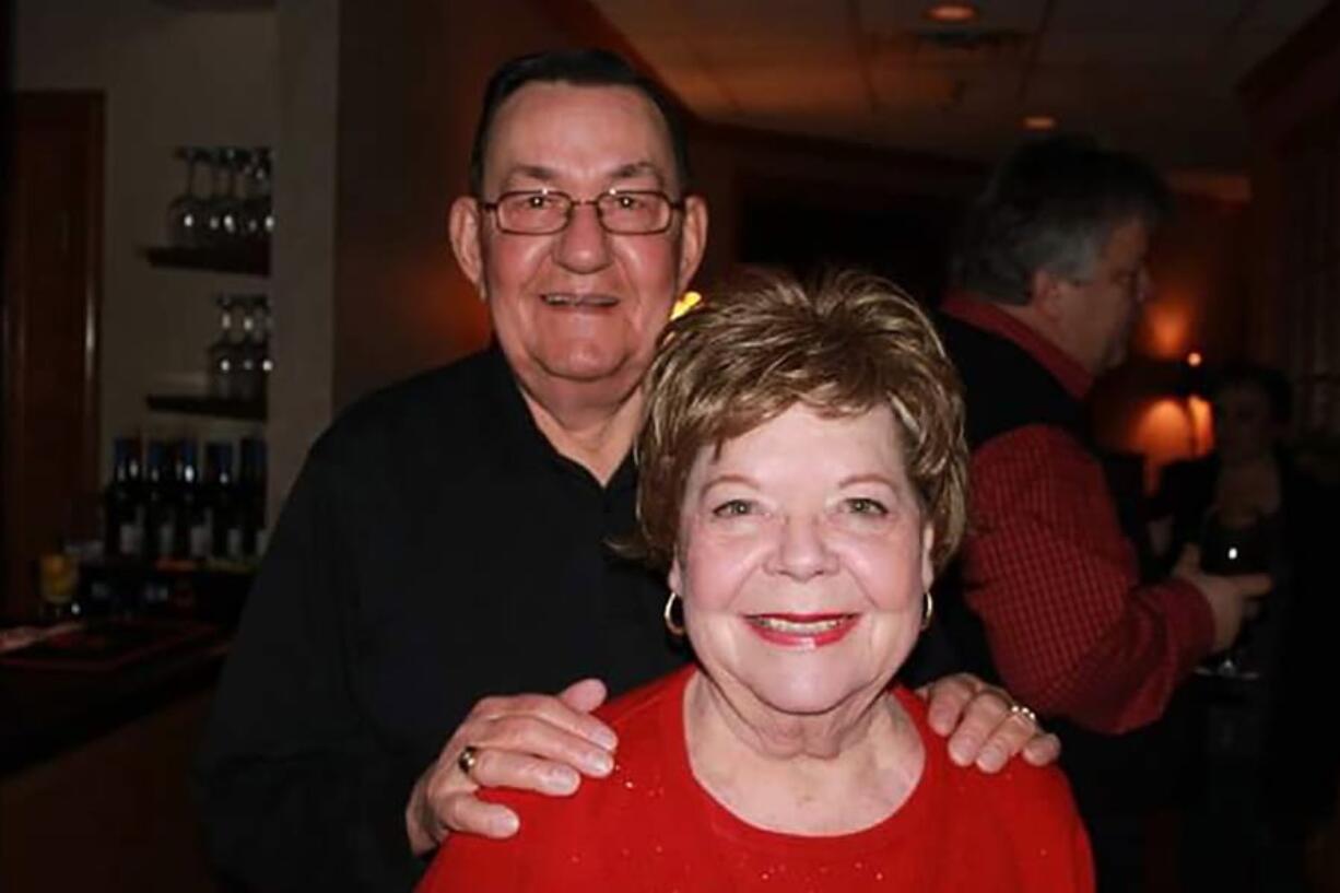 In this 2011 family photo provided by Dawn Bouska, Charles Recka and his wife, Patricia Recka, pose for a photo at a banquet in Naperville, Ill. Charles Recka died on March 12, 2020. Deep into the obituary for 87-year-old Recka is the short announcement that &quot;a Mass Celebrating his life will be held at a later date,&quot; a quiet signal popping up in death notices all over the country that the coronavirus that&#039;s changed everything about our lives has dramatically changed the way we grieve for the dead, too.