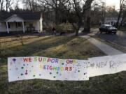 A sign showing support for residents is displayed on a lawn in New Rochelle, N.Y., Wednesday, March 11, 2020. State officials are shuttering several schools and houses of worship for two weeks in the New York City suburb and sending in the National Guard to help with what appears to be the nation&#039;s biggest cluster of coronavirus cases, Gov. Andrew Cuomo said Tuesday.