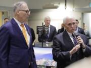 Vice President Mike Pence, right, speaks with Gov. Jay Inslee at the Washington State Emergency Operations Center, Thursday, March 5, 2020 at Camp Murray in Washington state. Pence was visiting to discuss Washington state&#039;s efforts to fight the COVID-19 coronavirus. (AP Photo/Ted S.