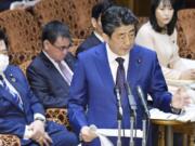 Japan&#039;s Prime Minister Shinzo Abe speaks at a parliamentary session in Tokyo Monday, March 23, 2020. Abe said a postponement of Tokyo Olympics would be unavoidable if the games cannot be held in a complete way because of the coronavirus pandemic.