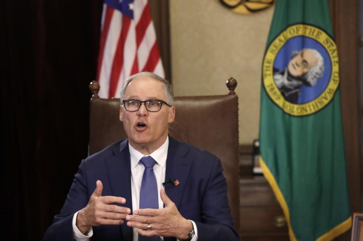 Washington Gov. Jay Inslee practices as he prepares to speak about additional plans to slow the spread of coronavirus before a televised address from his office Monday, March 23, 2020, in Olympia, Wash. Inslee has ordered non-essential businesses to close and the state&#039;s more than 7 million residents to stay home unless necessary in order to slow the spread of COVID-19.