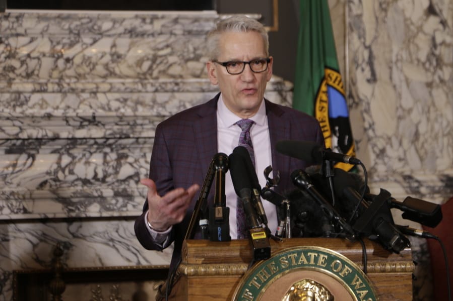 State Secretary of Health John Wiesman talks to the media about the decision to close schools in three counties in response to COVID-19, Thursday, March 12, 2020, in Olympia, Wash. All public and private K-12 schools in King, Pierce and Snohomish counties will be closed for six weeks, and Gov. Jay Inslee said there could be closures in more counties soon.