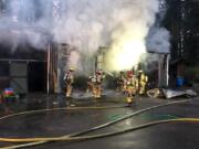 Clark County Fire & Rescue personnel battle a barn fire on 239th Street.