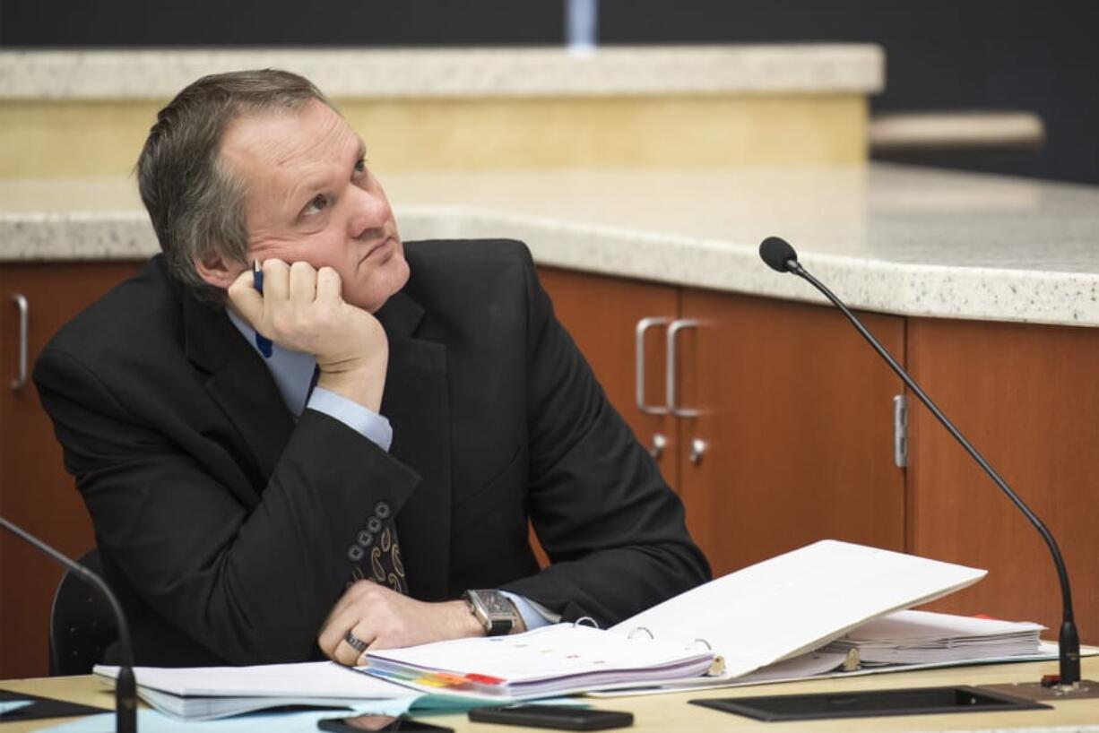 County Manager Shawn Henessee watches a video presentation during a Clark County Council meeting at the Public Service Center in January 2019.