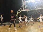 Katelynn Forner (10) looks to enter a pass in the post during Wednesday's Round-of-12 game at the Tacoma Dome.