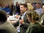 Paul Dennis, then- executive director of the Camas Washougal Economic Development Association, speaks to a joint meeting of the Camas and Washougal city councils in 2011.