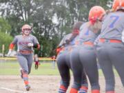 Ridgefield seniors Mia Tomillo, left, is a key piece for the Spudders on the softball field.