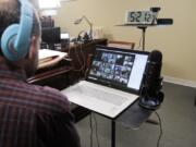 Jeffrey Smith, artistic director and conductor of the Philadelphia Boys Choir and Chorale, leads a virtual rehearsal with dozens of young choir members March 18.