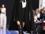 A model in a cape walks the runway during the Elie Saab show as part of the Paris Fashion Week Womenswear Fall/Winter 2020/2021 on Feb. 29 in Paris, France.