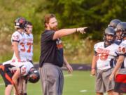 Gods Play T-shirt by First Down Clothing, local company started up by Prairie football coach Mike Peck and Kalama coach Sean McDonald (Photo courtesy of The Longview Daily News)