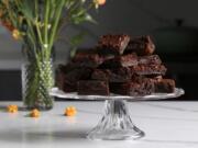 Brownies made with green banana flour are studded with cacao nibs for more chocolate flavor and for texture.