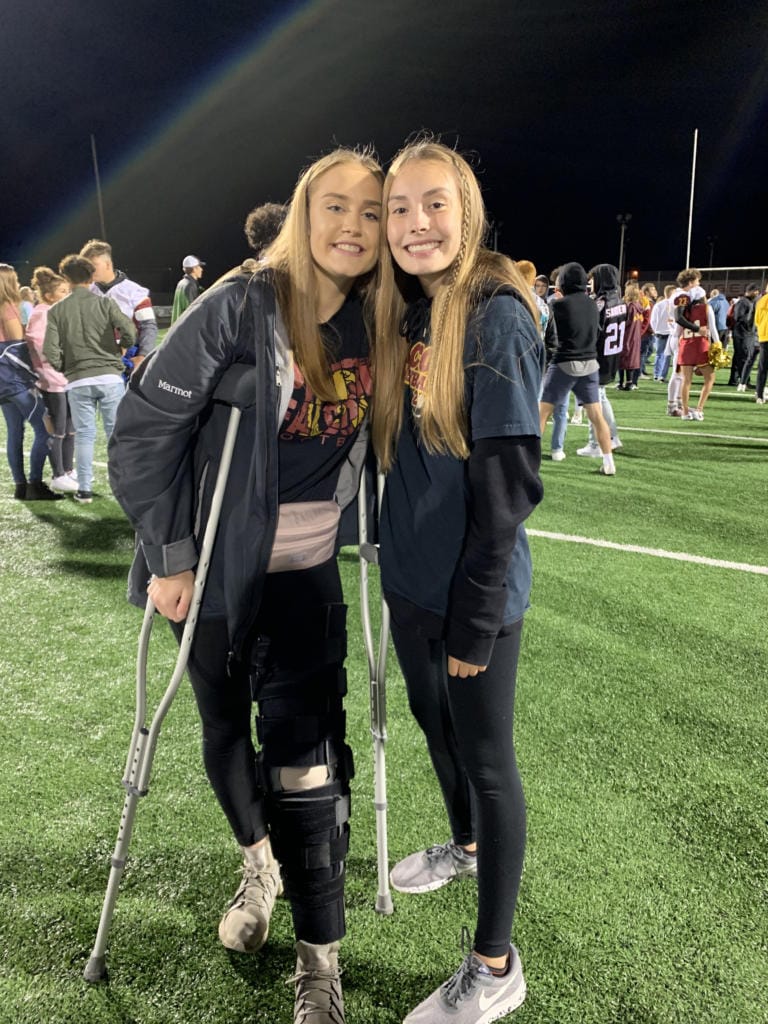 Amelia Renner, left, with friend Jordan Peterson at a Prairie football game in October (Photo provided by Renner family)