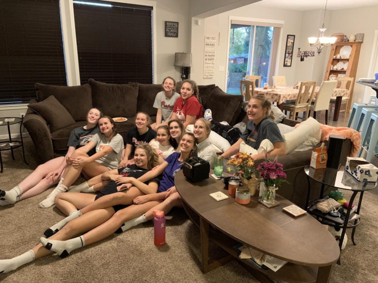The Prairie High volleyball team enjoys a team dinner in the Renner home after Amelia’s first knee surgery (Photo provided by the Renner family)