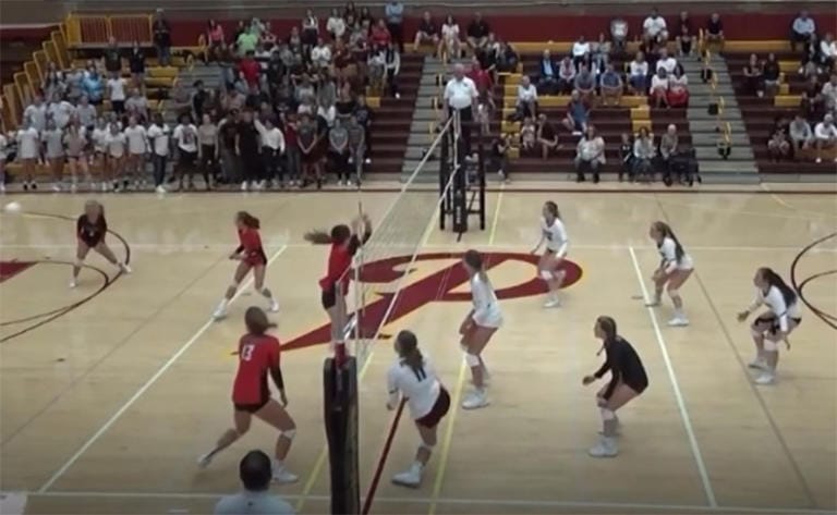 A screen grab from the video when Prairie’a Amelia Renner (in white, bottom of frame) suffered a traumatic knee injury in volleyball match last September.