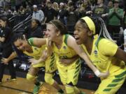 Oregon's Satou Sabally, left, Sabrina Ionescu and Ruthy Hebard, right, were all top-8 first-round picks in the WNBA draft on Friday, April 17, 2020.