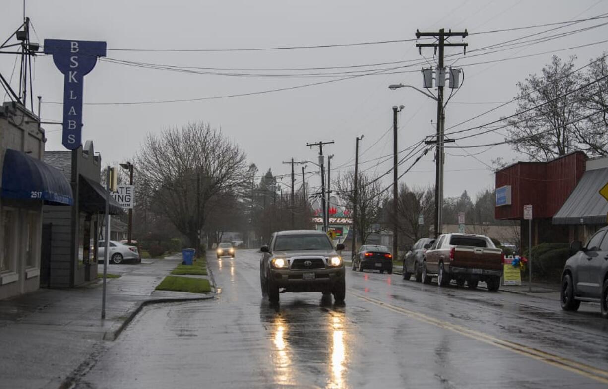 A motorist drives past businesses while traveling east along East Evergreen Boulevard on Thursday morning, Dec. 12, 2019.