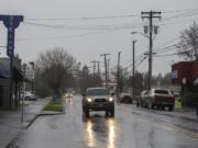 A motorist drives past businesses while traveling east along East Evergreen Boulevard on Thursday morning, Dec. 12, 2019.