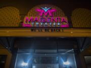 A sign outside Magenta Theater on Main Street in downtown Vancouver reassures the public of their return, as seen March 27.