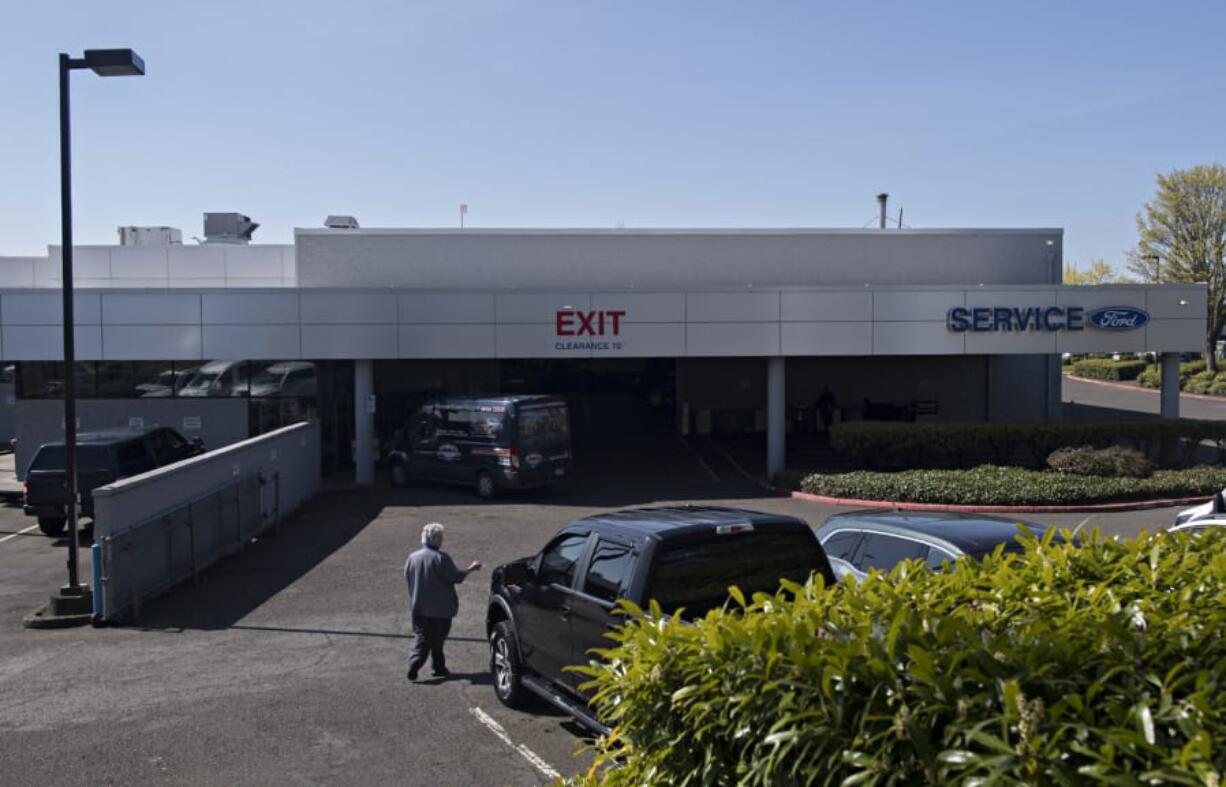 Work continues on vehicles in the service department at Vancouver Ford. Gov. Jay Inslee&#039;s statewide stay-at-home order allowed car maintenance to continue as an essential service, but he did not make an exception for sales. Many car dealerships do both, which has put their operations in an unusual position.