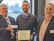 VANCOUVER: Jeff Lightburn, left, and Tom Boardman, right, of the Fort Vancouver Sons of the American Revolution Chapter, present John Zingale his SAR History Teacher of the Year Certificate and $200 check.