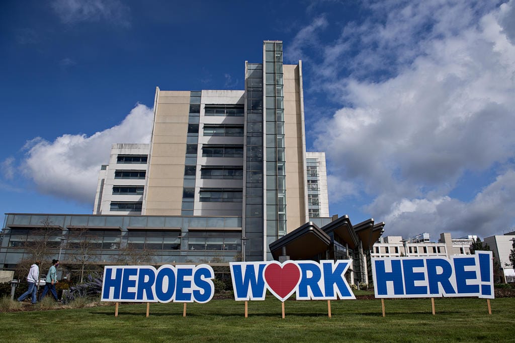 A sign outside PeaceHealth Southwest Medical Center honors hospital staff working hard to treat patients during the COVID-19 crisis Thursday morning, April 2, 2020.