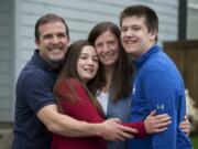 Stephen Flach of Vancouver, from left, his daughter, Lauren, 11, his wife, Courtney, and his son, Robert, 15, have tried to find the silver lining in the COVID-19 quarantine.