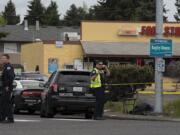 Police at the scene of the fatal shooting of William Abbe on Fourth Plain Boulevard and Stapleton Road on April 28, 2020.