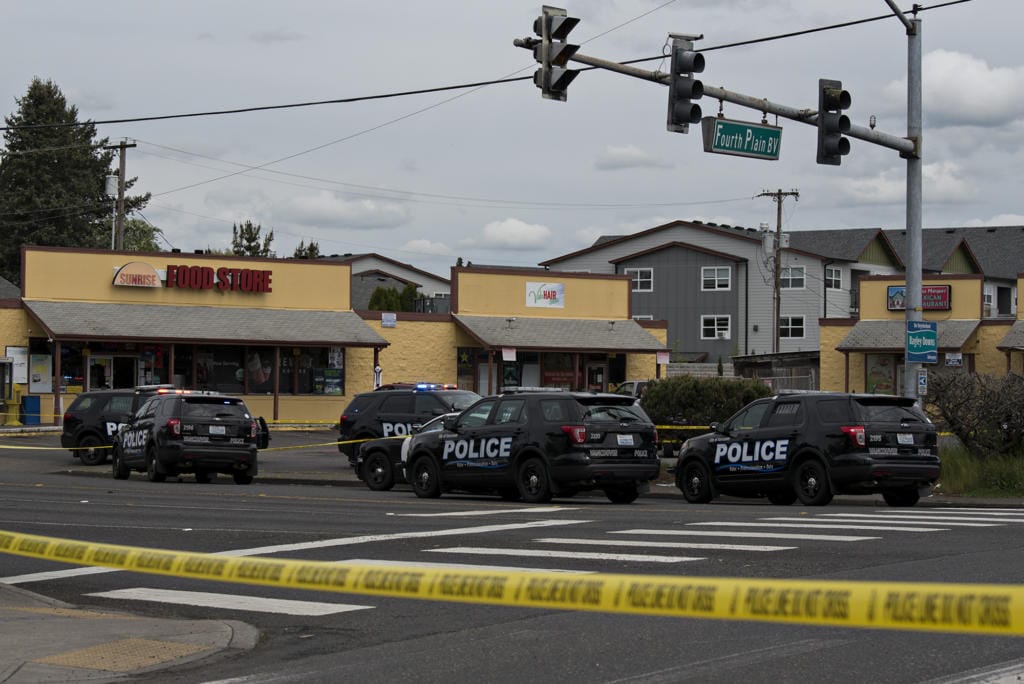 Police work at the scene of a reported officer-involved shooting at the intersection of Fourth Plain Boulevard and Stapleton Road on Tuesday afternoon, April 28, 2020.