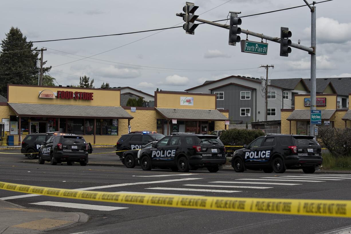 Police work at the scene of a reported officer-involved shooting at the intersection of Fourth Plain Boulevard and Stapleton Road on Tuesday afternoon, April 28, 2020.