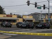 Police work at the scene of a reported officer-involved shooting at the intersection of Fourth Plain Boulevard and Stapleton Road on Tuesday afternoon, April 28, 2020.