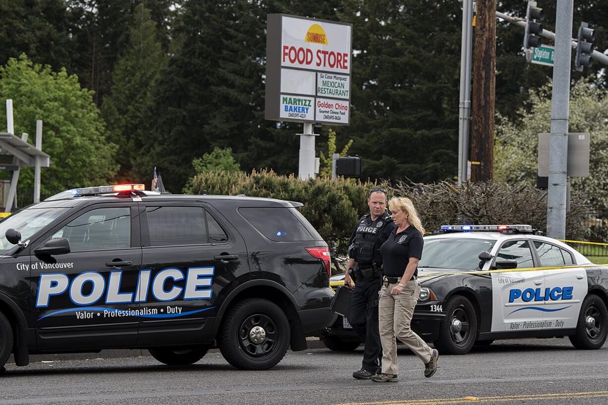 Police investigate the shooting of William Abbe at the intersection of Fourth Plain Boulevard and Stapleton Road on April 28, 2020.