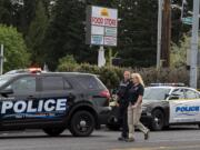 Police investigate the shooting of William Abbe at the intersection of Fourth Plain Boulevard and Stapleton Road on April 28, 2020.