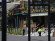 A security guard inside the main gates to Wimbledon as it is announced the the Wimbledon tennis Championships for 2020 has been cancelled due to the coronavirus in London, Wednesday, April 1, 2020.