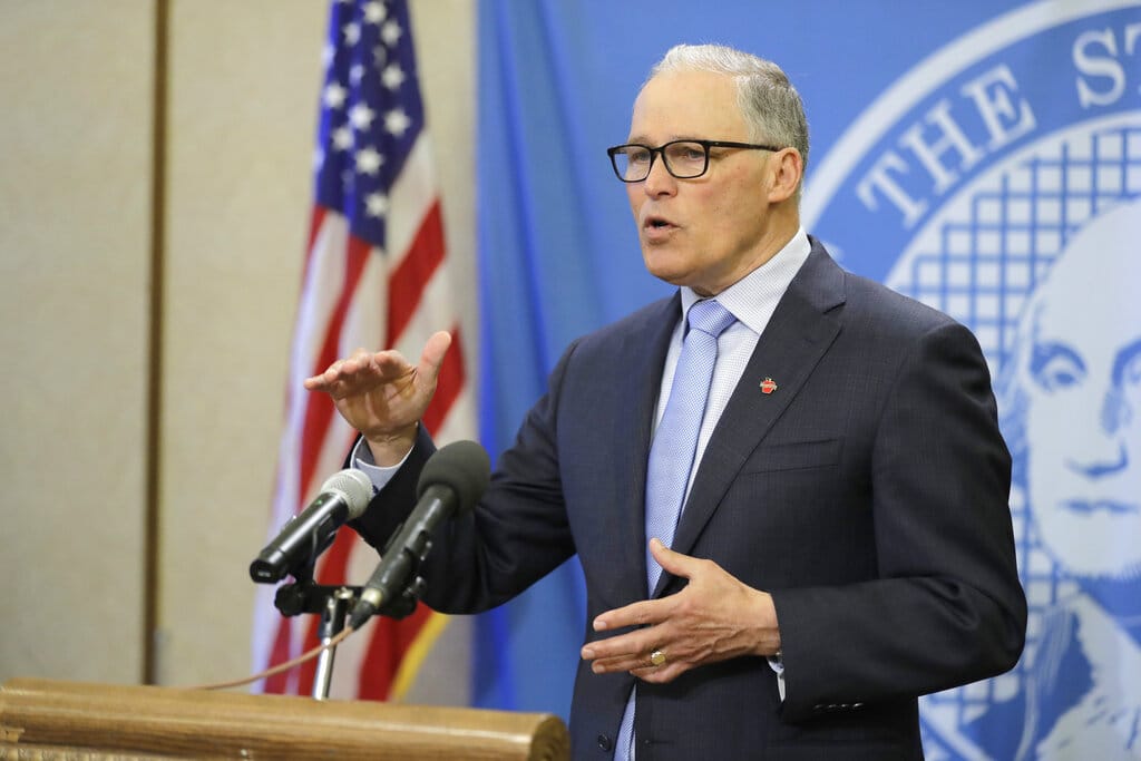 Washington Gov. Jay Inslee speaks at a news conference, Monday, April 6, 2020, at the Capitol in Olympia, Wash. Inslee announced Monday that schools will remain physically closed for the remainder of the school year due to the coronavirus outbreak, and that public and private school students will continue distance learning through June. (AP Photo/Ted S.