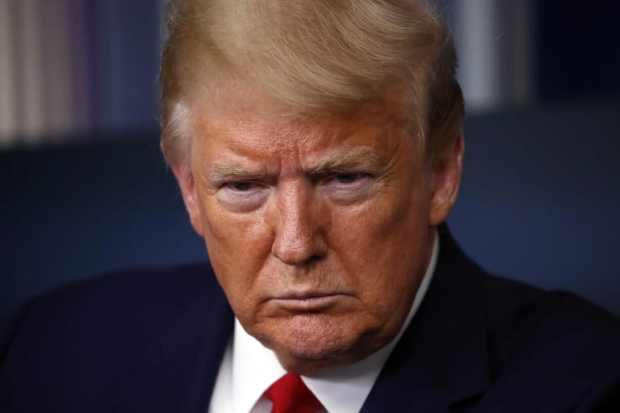 President Donald Trump listens to a question from a reporter as he speaks about the coronavirus in the James Brady Press Briefing Room of the White House, Monday, April 6, 2020, in Washington.