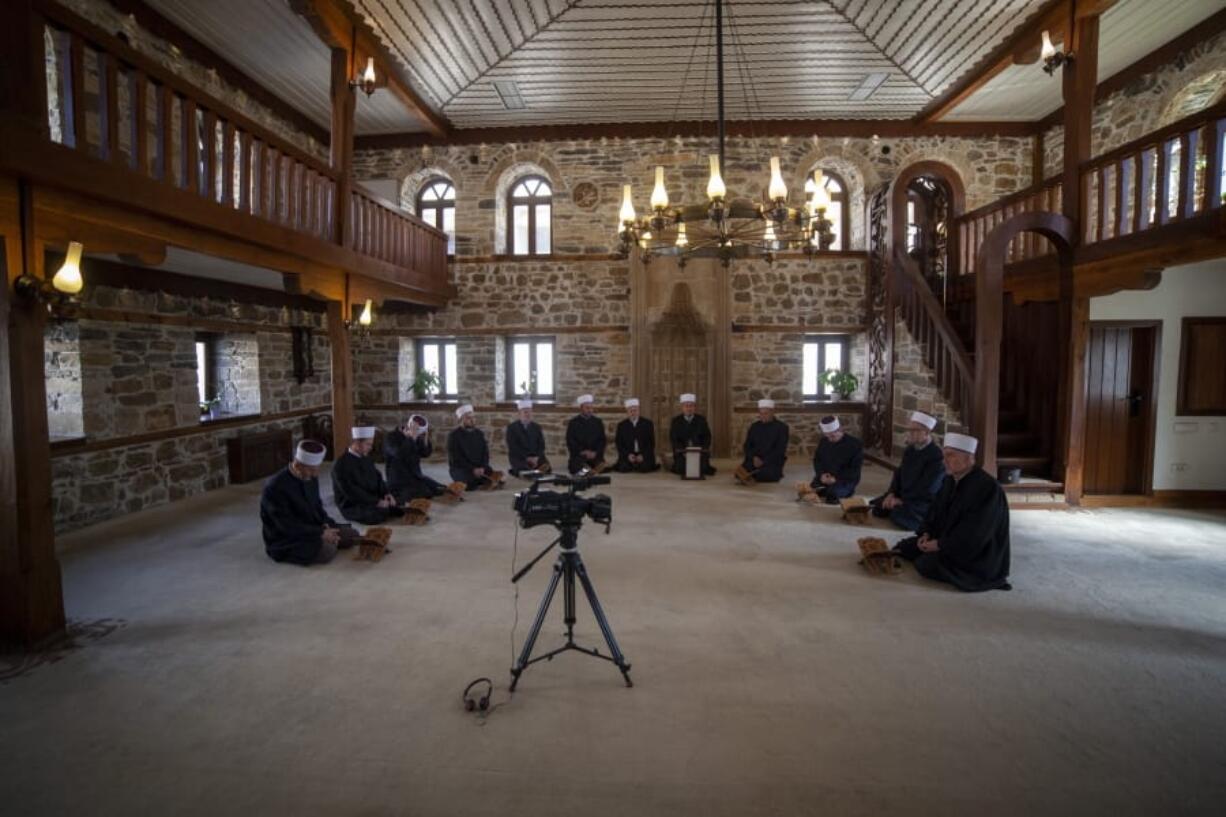 Imams attend the Ramadan prayer at a mosque empty of faithful due to social distancing guidelines during the coronavirus outbreak in Zenica, central Bosnia, Thursday, April 23, 2020. The COVID-19 virus pandemic is cutting off the world&#039;s Muslims from their cherished Ramadan traditions.