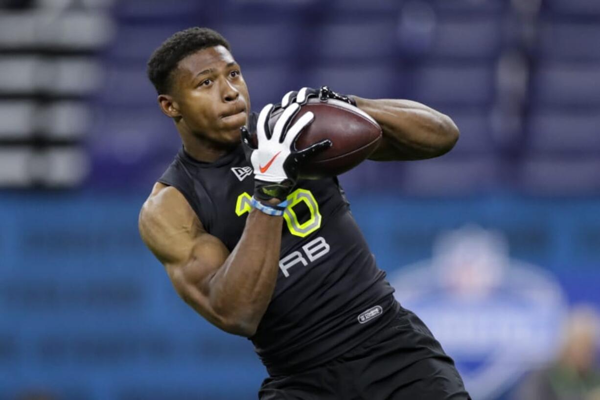 UCLA running back Joshua Kelley runs a drill at the NFL football scouting combine on Feb. 28, 2020, in Indianapolis. Kelley was looking forward to visiting various NFL teams, checking out their facilities and meeting coaches before the Covid-19 global pandemic changed the pre-draft process.