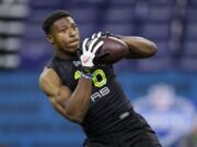 UCLA running back Joshua Kelley runs a drill at the NFL football scouting combine on Feb. 28, 2020, in Indianapolis. Kelley was looking forward to visiting various NFL teams, checking out their facilities and meeting coaches before the Covid-19 global pandemic changed the pre-draft process.