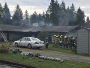 Fire District 5 crews battle a house fire in the Sifton area on Monday morning.