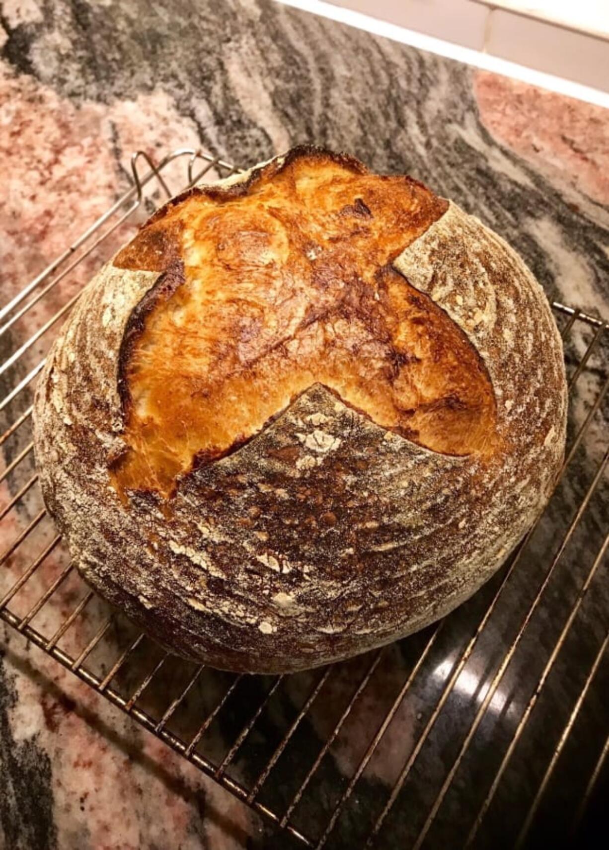 A freshly-baked loaf of sourdough bread appears at a home in London. With millions of people across the globe working at home due to lockdown measures imposed during the coronavirus pandemic, many people are choosing to make their own bread, rather than venturing to the local store to buy their weekly fix.