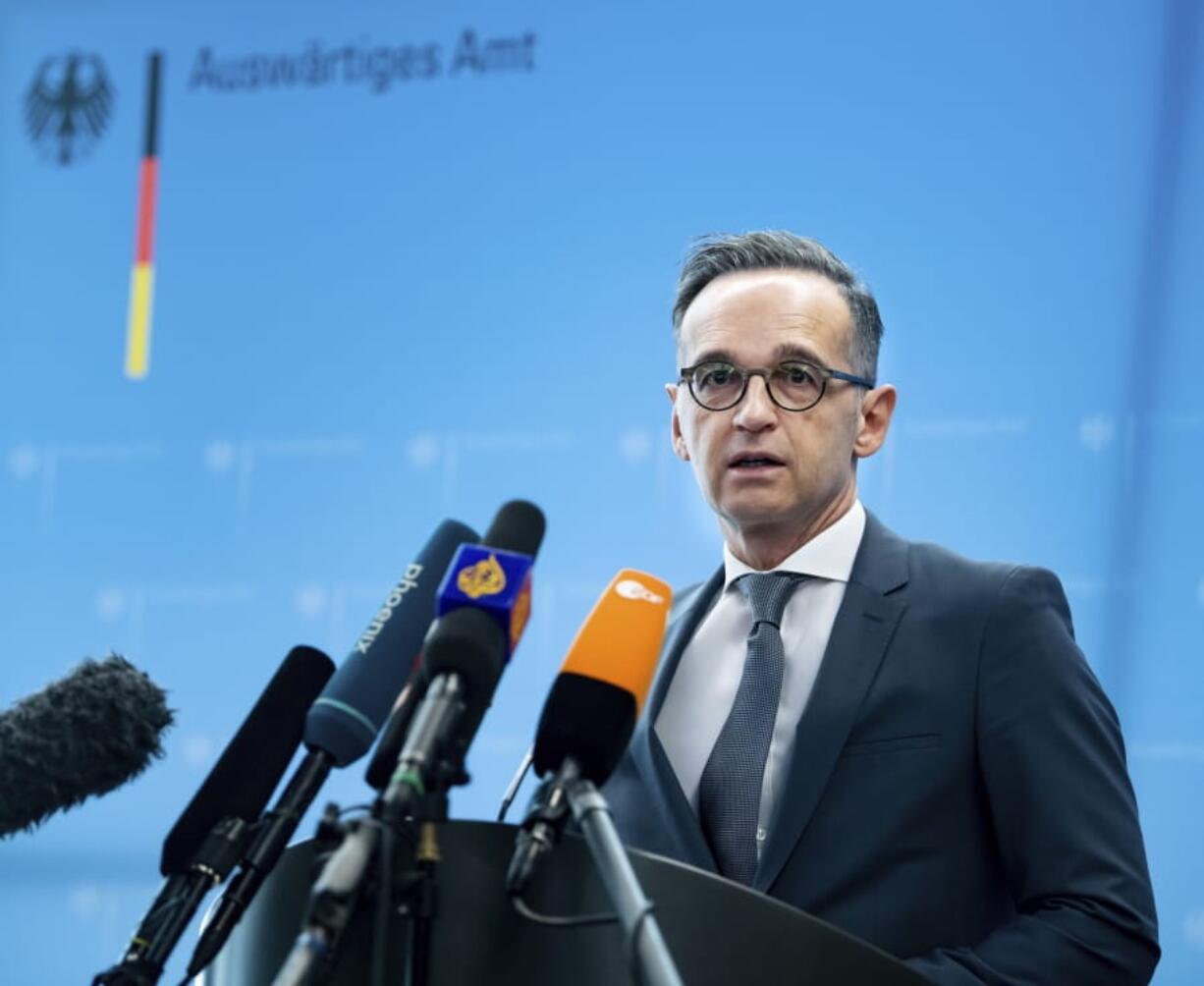 German Foreign Minister Heiko Maas briefs the media during a news conference on current developments in the worldwide spread of the coronavirus at the foreign ministry in Berlin, Germany, Tuesday, March 17, 2020. For most people, the new coronavirus causes only mild or moderate symptoms, such as fever and cough. For some, especially older adults and people with existing health problems, it can cause more severe illness, including pneumonia.