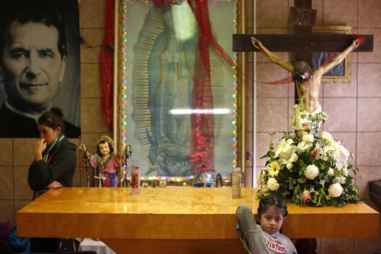 Migrants rest Feb. 26 in the chapel of the San Juan Bosco migrant shelter, in Nogales, Mexico. For years, Catholic-led, United States-based nonprofits have been at the forefront of efforts to support migrants and asylum-seekers along the Mexican border. Tough new border policies, coupled with the COVID-19 pandemic, have drastically changed their work, much of which now takes place in Mexico.